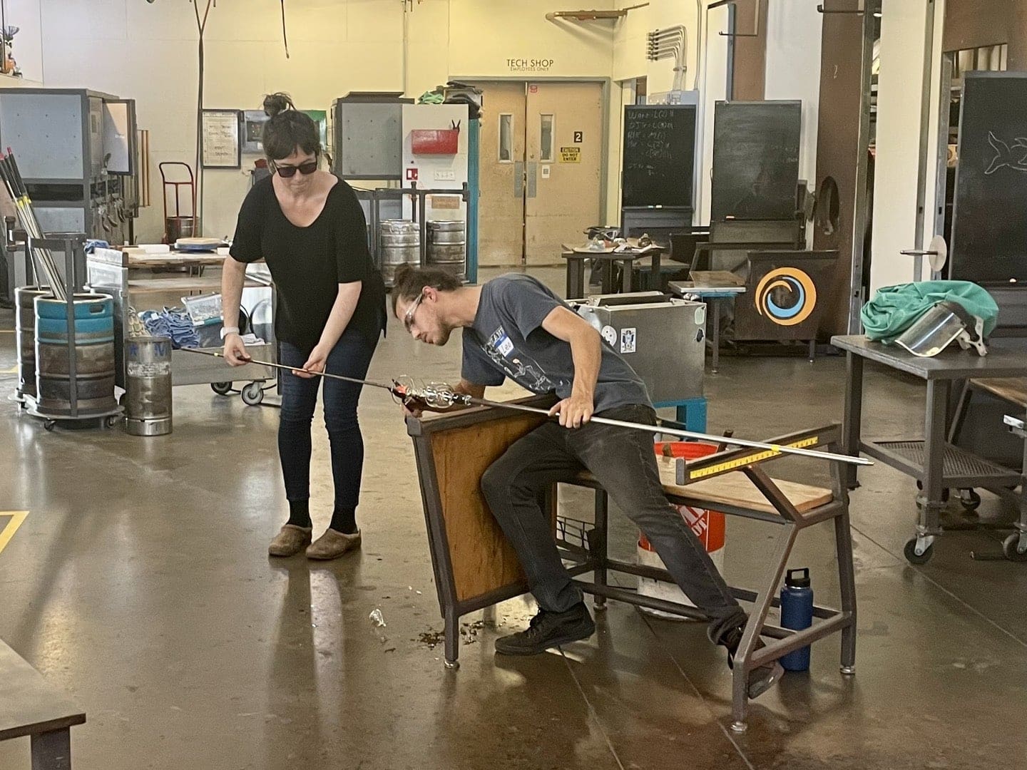 Students learn the science behind the art of glass blowing at the