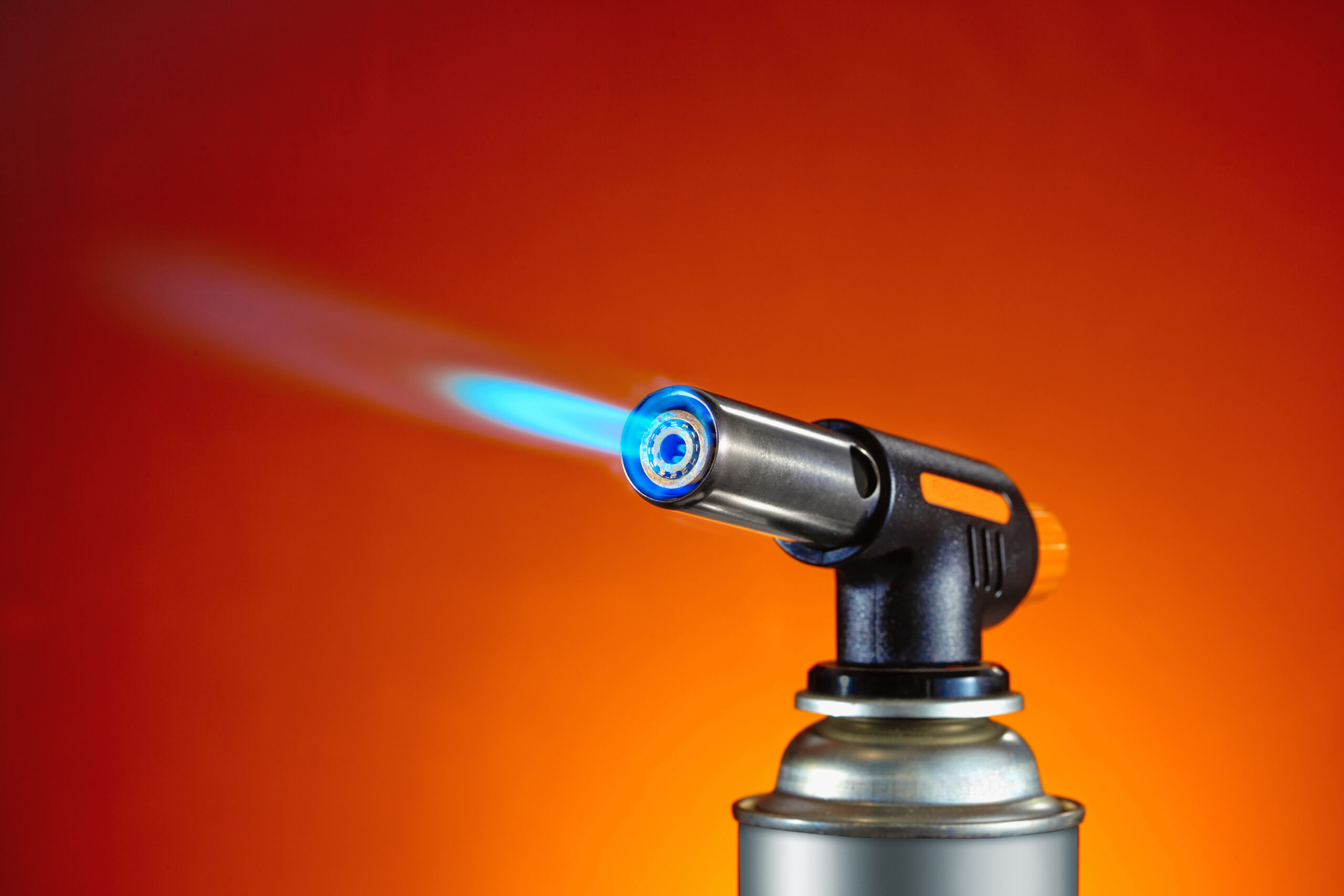 Flame,From,Blowtorch,With,Orange,Background