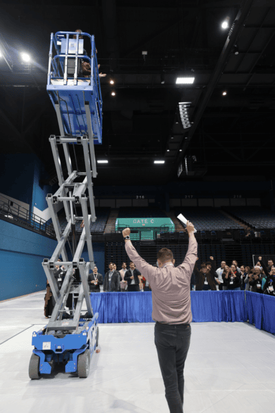 Milos Dujovic, a PCSA representative, celebrates the winning team at the Shot Glass Competition.